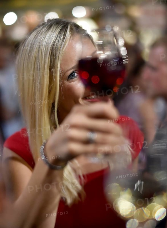Woman celebrating with wine glass