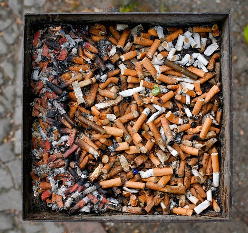 Full ashtray with cigarette butts