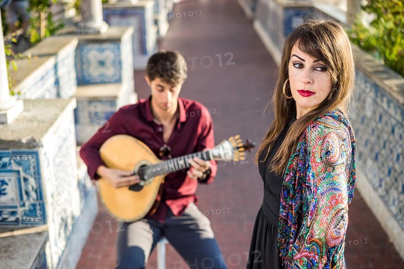 Band performing traditional music fado under pergola with portuguese tiles called azulejos in Lisbon