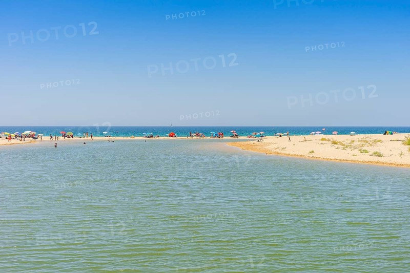 people relaxing on Salgados Beach between Albufeira and Armacao de Pera