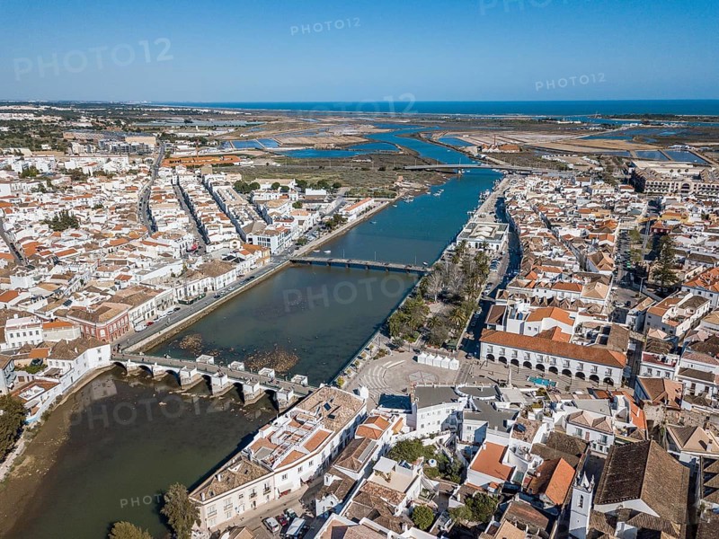 City view with roman bridge over Gilao river in old fishermen's town
