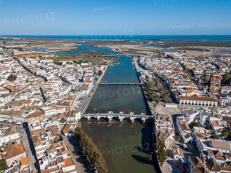 City view with roman bridge over Gilao river in old fishermen's town