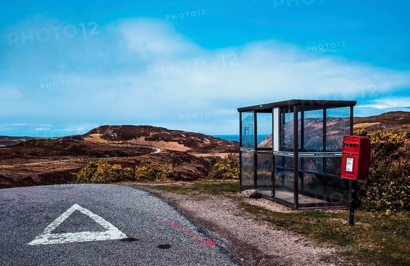 Shelter for hikers and red post box on the street