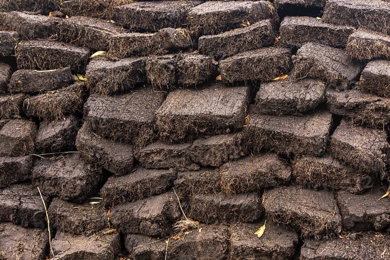 Stacked cut peat in raised bog