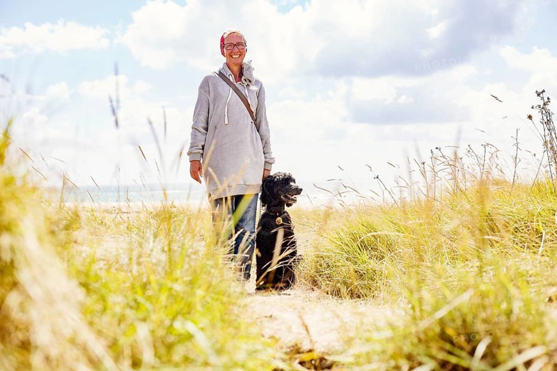 Woman walks with her dog