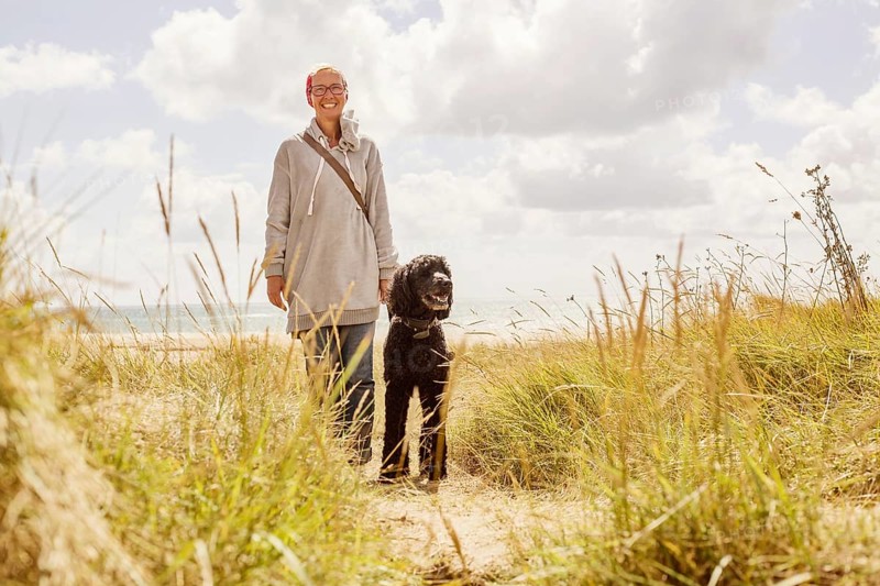 Woman walks with her dog