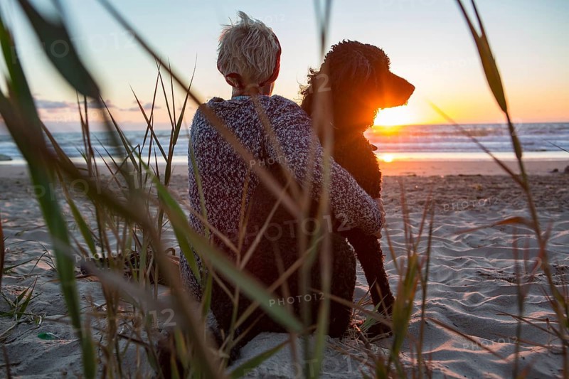 Woman sits with her dog