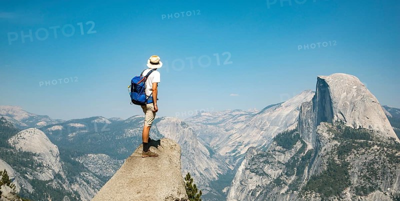 Young man standing on ledge