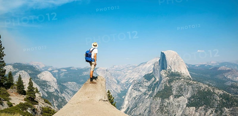 Young man standing on ledge