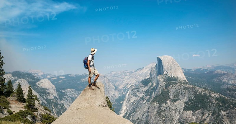 Young man standing on ledge