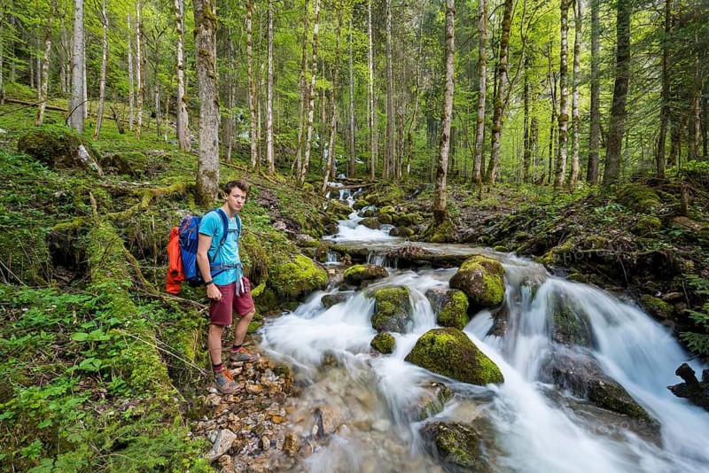 Young man by a creek