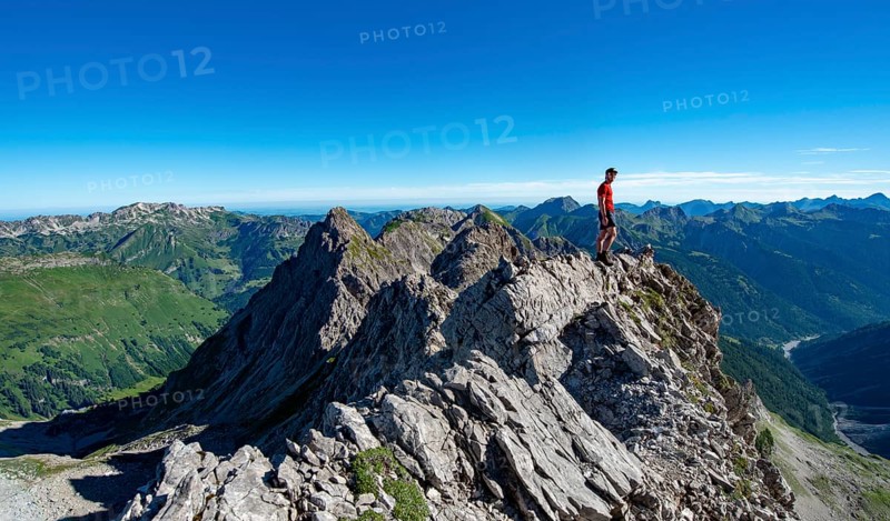Hiker stands on rocks