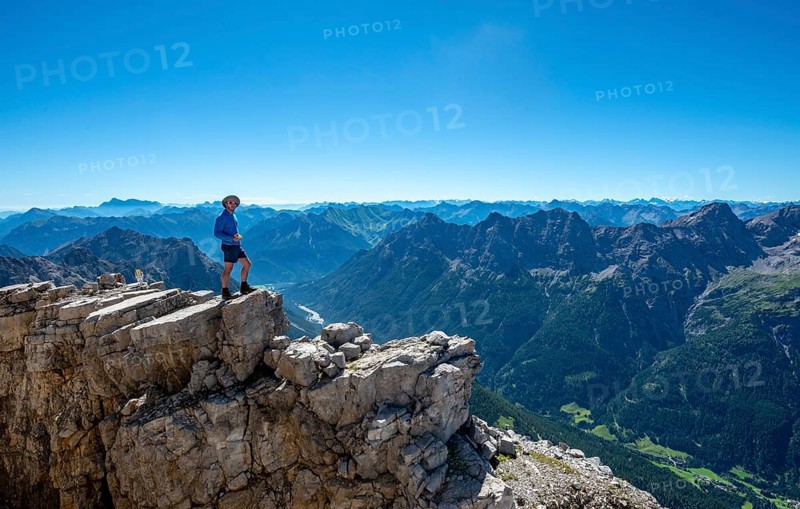 Hiker at the summit of the Hochvogel