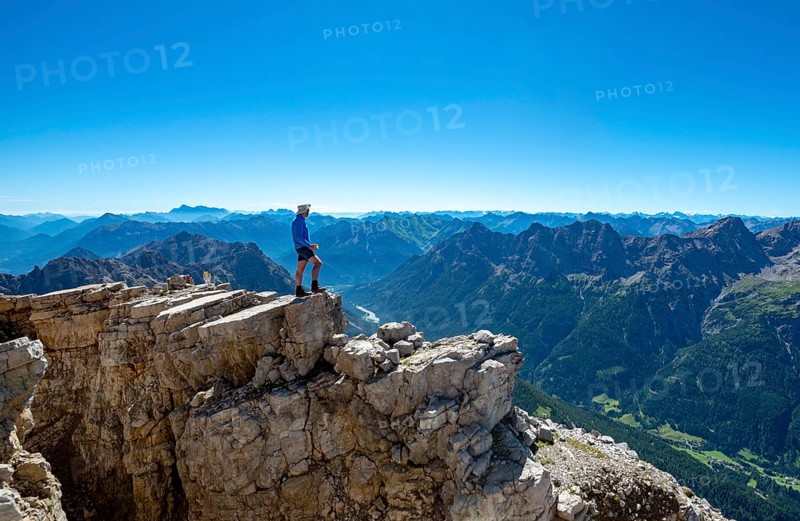 Hiker at the summit of the Hochvogel