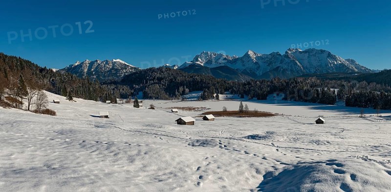 Frozen Lake Geroldsee in winter in front of Karwendel Mountains