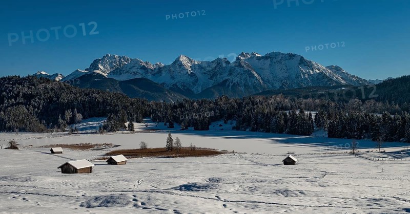 Frozen Lake Geroldsee in winter in front of Karwendel Mountains