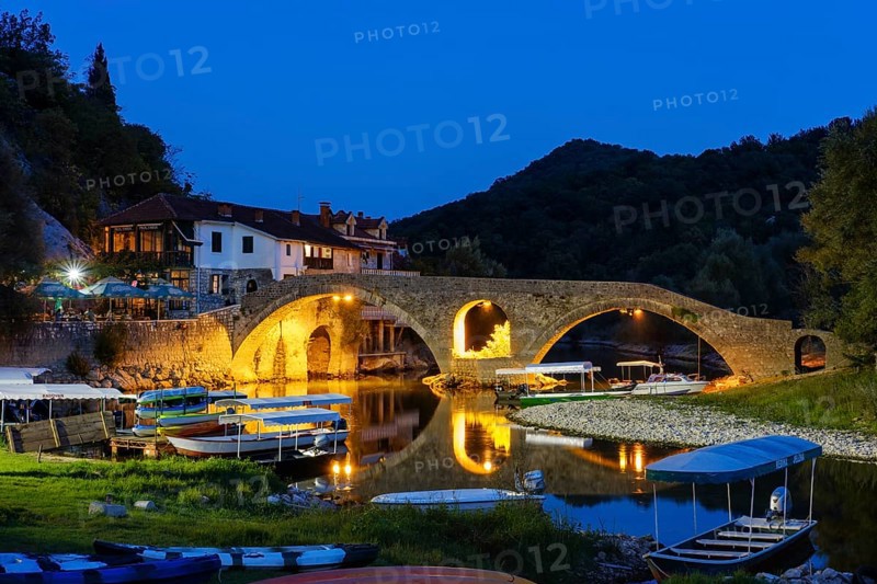 Excursion boats and Old Bridge Stari most at dusk