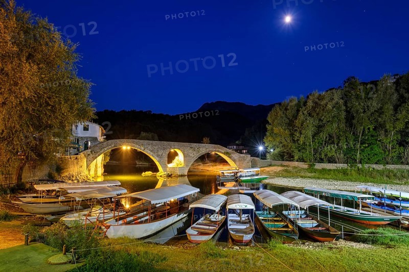 Excursion boats and Old Bridge Stari most at dusk