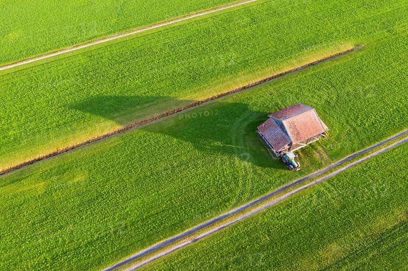 Meadows with barn and tractor