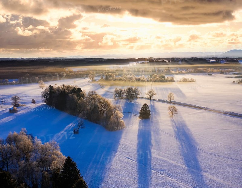Winter landscape with hoarfrost at sunrise