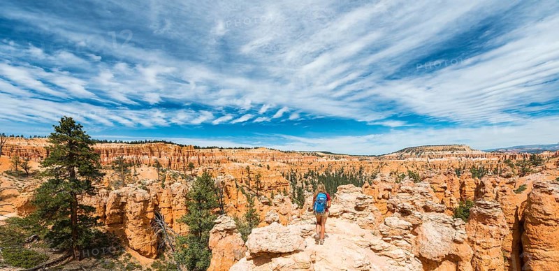 Hiker with backpack in bizarre landscape