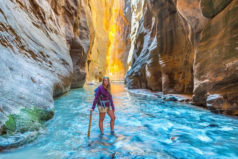 Hiker standing in river