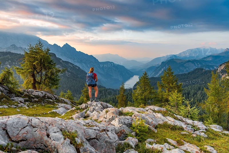 Hiker looks at mountain panorama