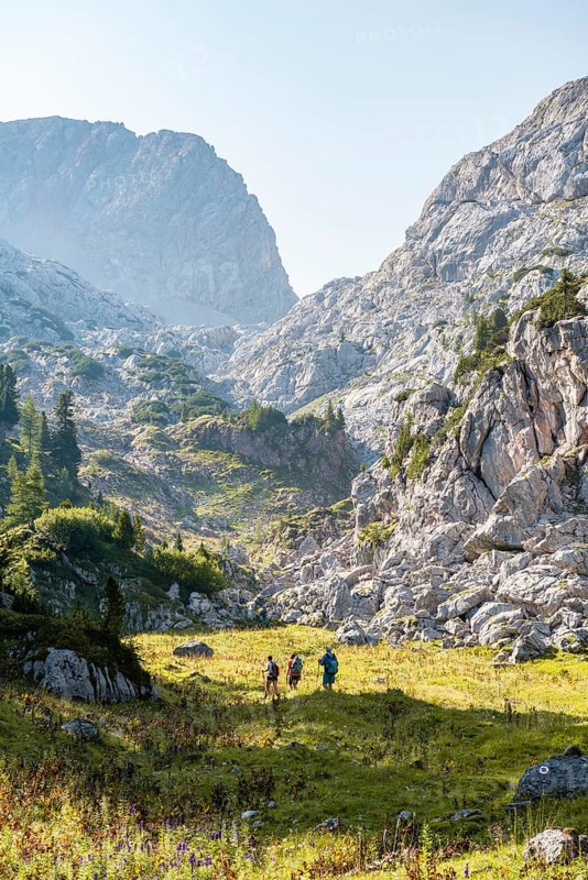 Three hikers in the distance
