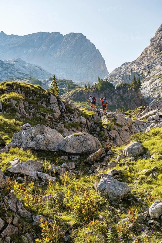 Two hikers on a rock