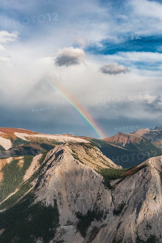 View from Sulphur Skyline Trail to mountain landscape with rainbow