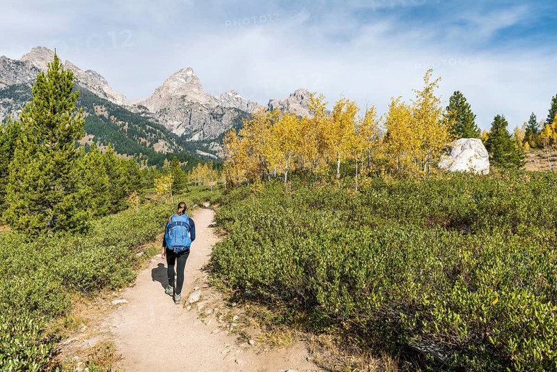 Young woman on the hiking trail to Taggart Lake