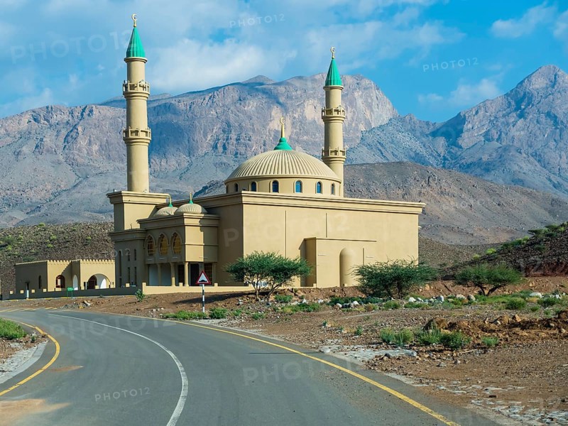 Mosque against mountain chain Jabal Misht