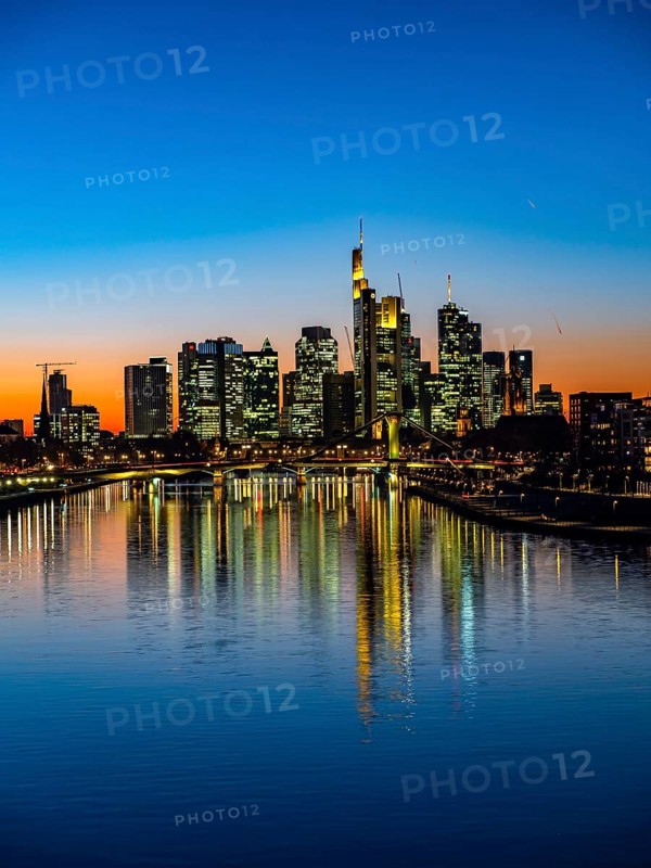 Deutschherrenbrucke with skyline at sunset