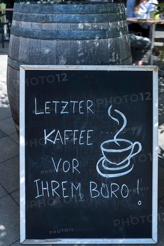 Advertising board in front of a cafe