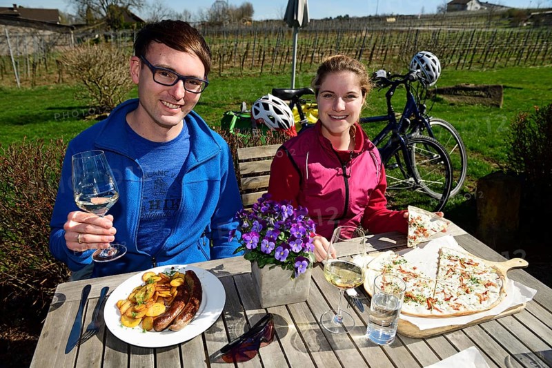 Cyclist at the rest with Flamkuchen