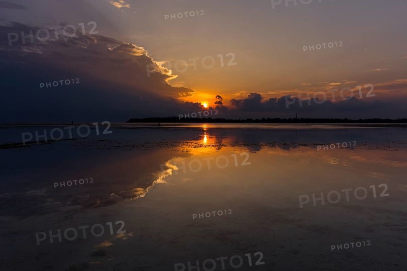 Sunset with dark clouds over the sea