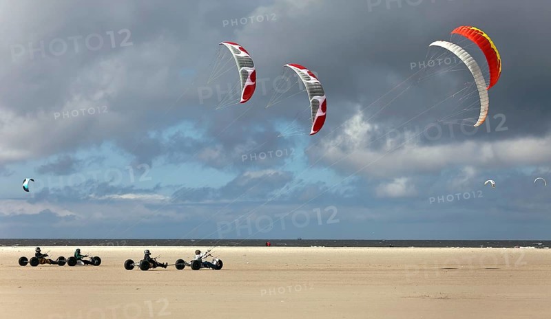 Beach sailer at the sandy beach with wind
