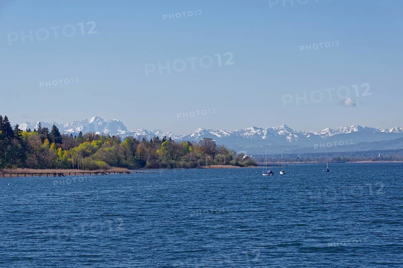 Lake Ammer near Hersching with the snow-covered Zugspitze massif and Alpine peaks