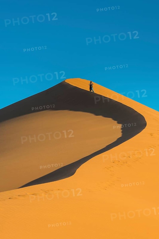 Woman on the the giant sanddune Dune 45