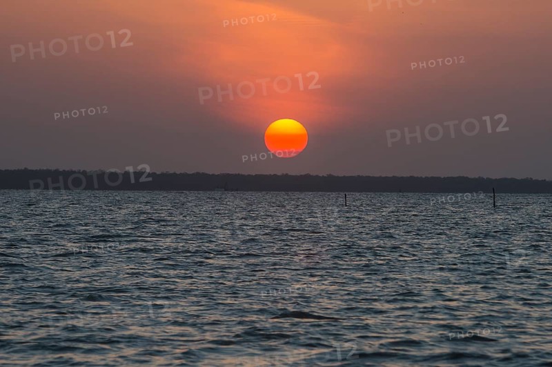 Sunset over the Suriname river near Paramaribo