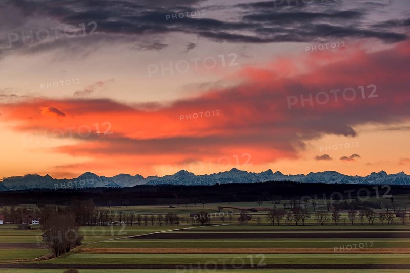 Sunrise over landscape with Alps
