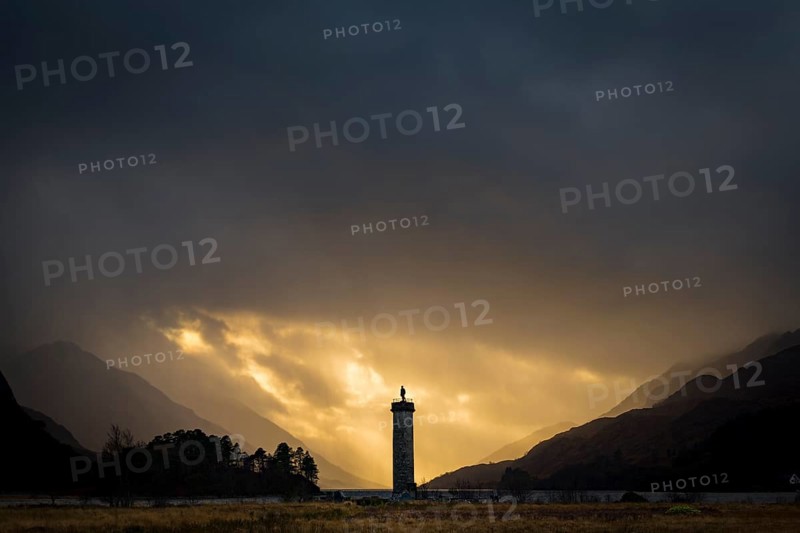 Loch Shiel with Glenfinnan Monument under threatening cloudy sky