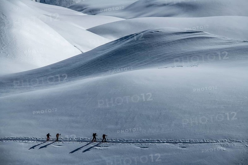 Ski mountaineers in winter landscape