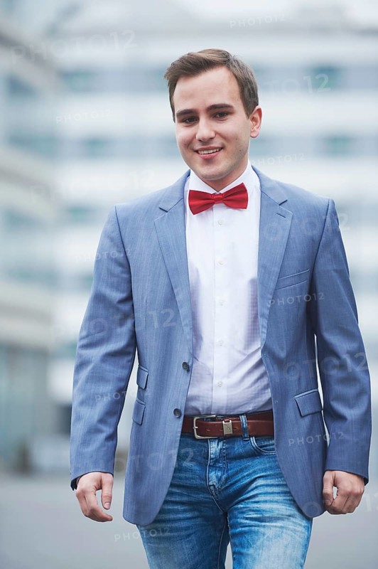 Young business man walking on street