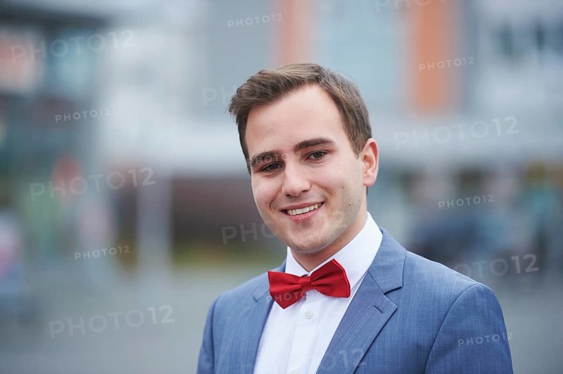 Young business man walking on street