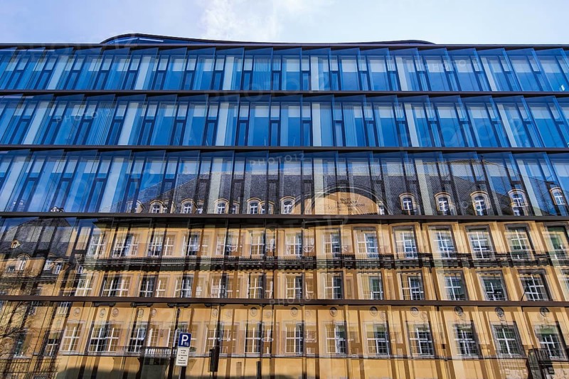 Blue glass facade with reflection
