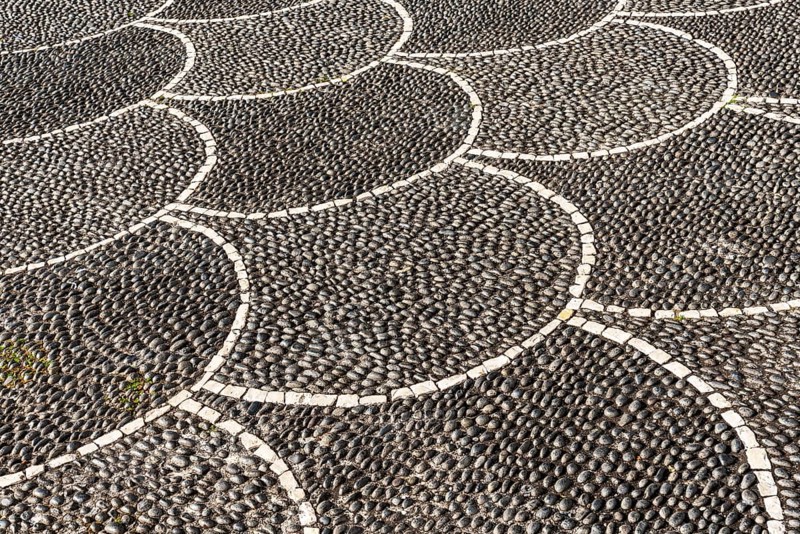 Black and white pebble floor mosaic