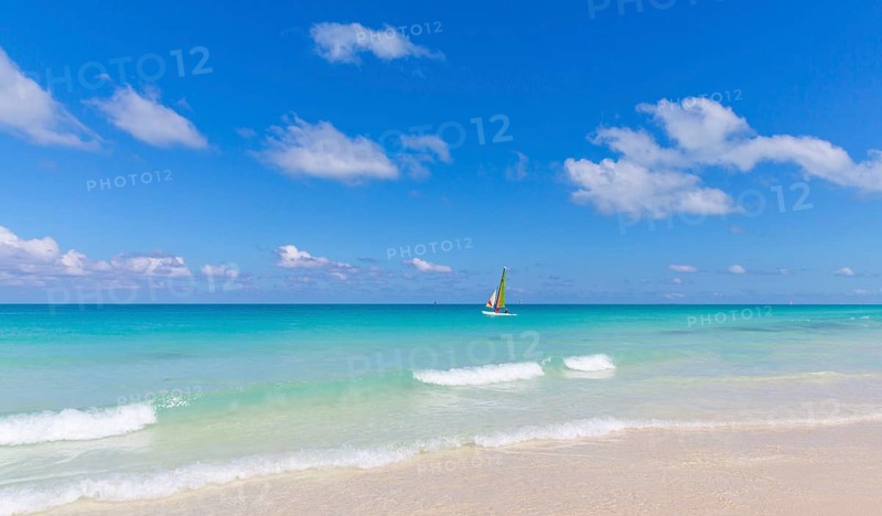 Sailboat in turquoise water