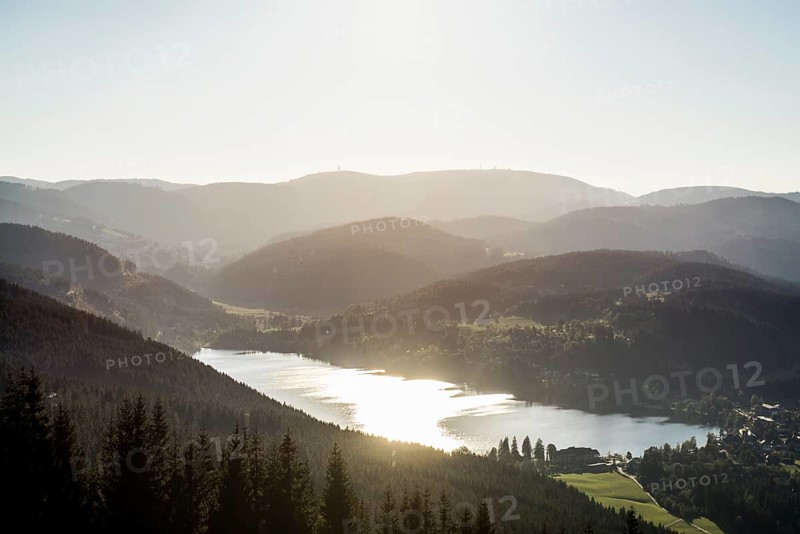 View from Hochfirst to Lake Titisee and Feldberg mountain at sunset