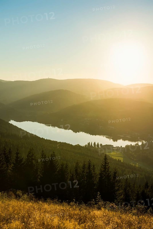 View from Hochfirst to Lake Titisee and Feldberg mountain at sunset